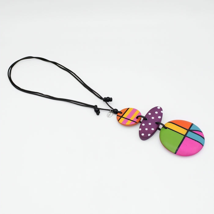 Colorful butterfly-shaped phone charm on a white background