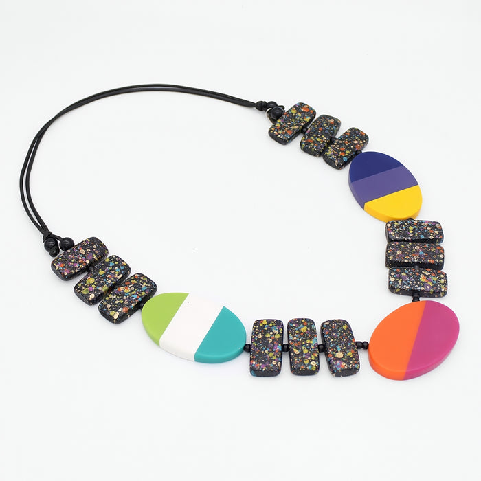 Colorful necklace with multicolored beads on a white background