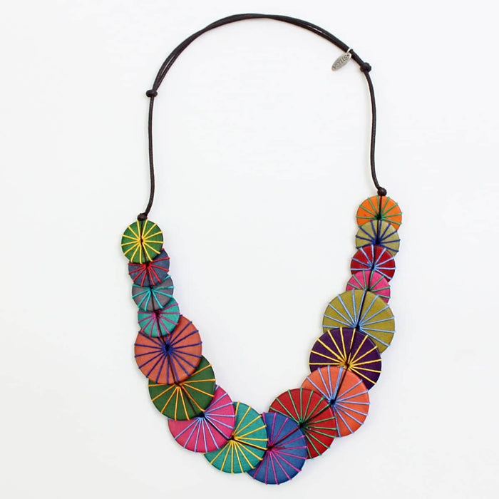 Colorful necklace with circular patterns on a white background