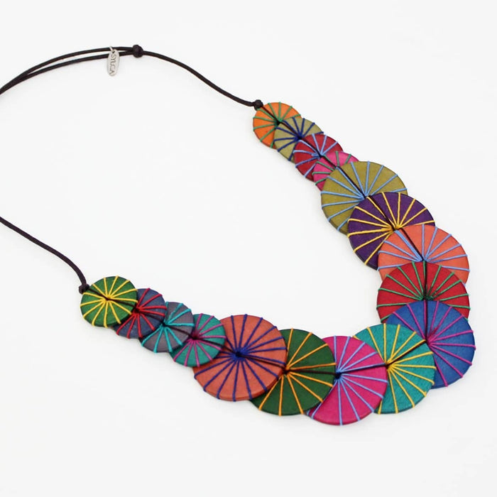 Colorful necklace with circular patterns on a white background