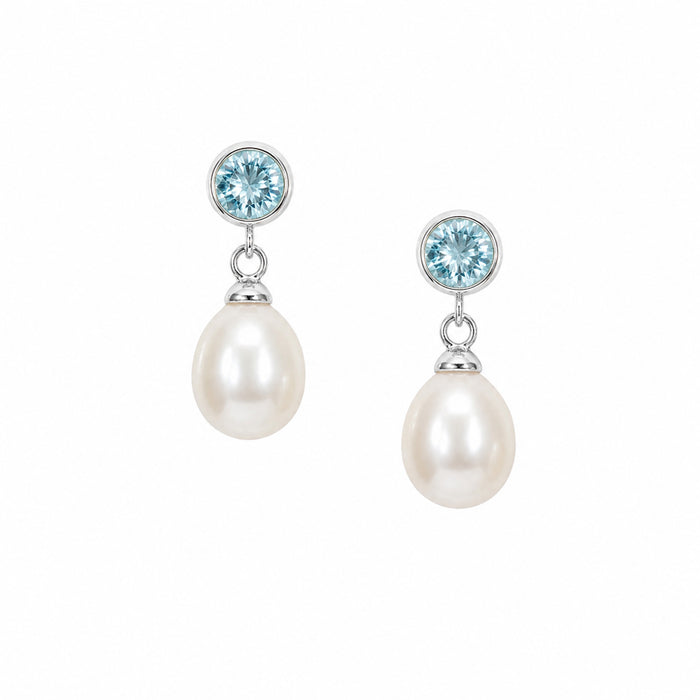 Ocean Blue Topaz Pearl Drop Studs in sterling silver with 6mm bezel-set blue topaz and 12mm white freshwater pearls