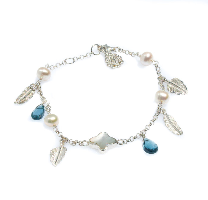 Ocean Breeze Pearl Bracelet Topaz crafted in premium 925 sterling silver featuring genuine freshwater pearls paired with sparkling blue topaz gemstones in a coastal-inspired bracelet design.