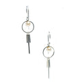 A pair of silver-colored earrings featuring freshwater pearl details, suspended from small circular hooks.