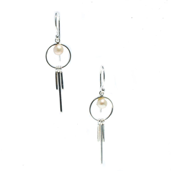 A pair of silver-colored earrings featuring freshwater pearl details, suspended from small circular hooks.
