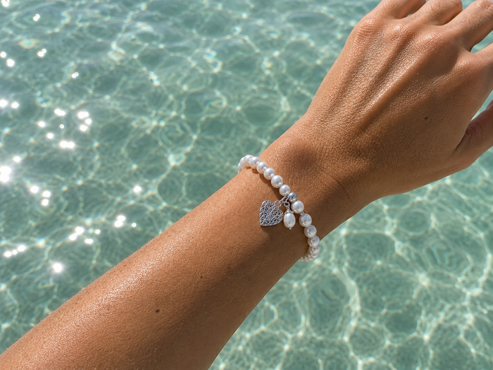 Pearl Silk Knot Bracelet Heart Pearl Charm featuring genuine freshwater pearls and a sterling silver heart charm.