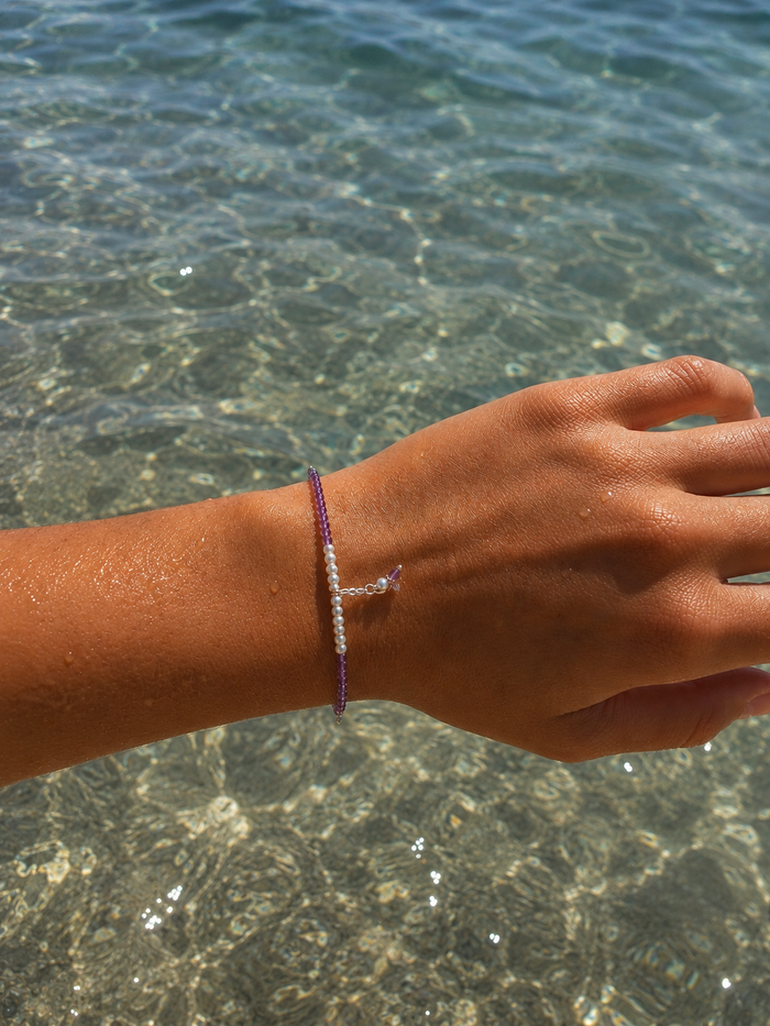 Ocean Spell Pearl Bracelet Amethyst featuring genuine amethyst gemstones, freshwater pearls and sterling silver accents on an adjustable bracelet.
