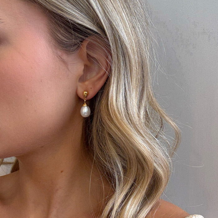 large pearl drop earrings in gold