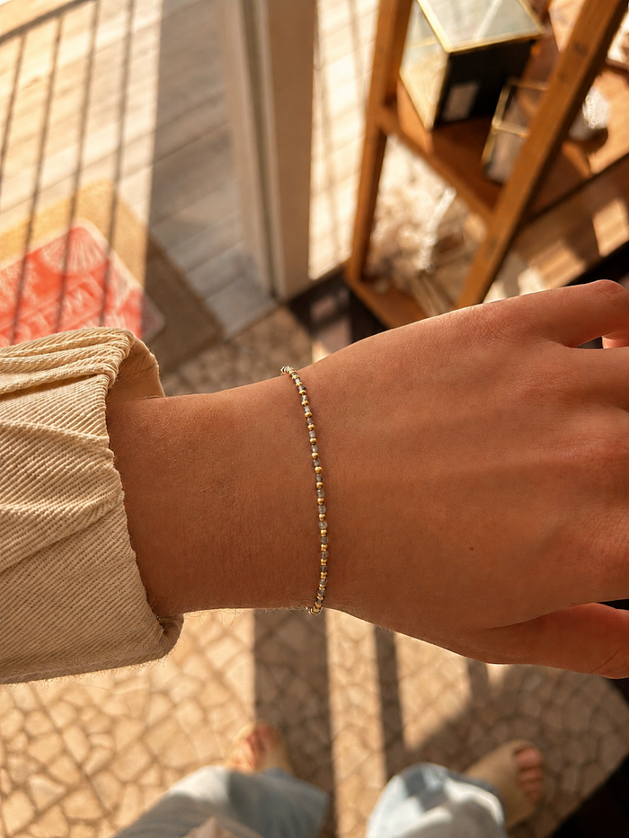 Oceanic Loops Labradorite Bracelet Gold featuring genuine labradorite gemstones with natural  iridescence, accented with gold vermeil beads and an adjustable chain. A delicate beach-inspired bracelet designed in Broome, Western Australia.