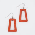Red rectangular earrings on a white background