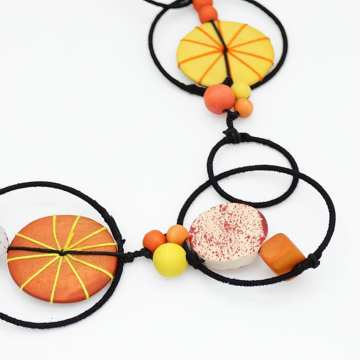 Necklace with colorful beads on a white background