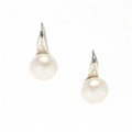 A pair of hook earrings featuring freshwater pearls attached to silver-colored bands.