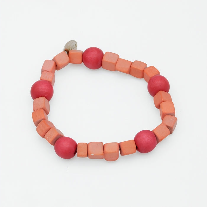 Bracelet with pink and orange beads on a white background