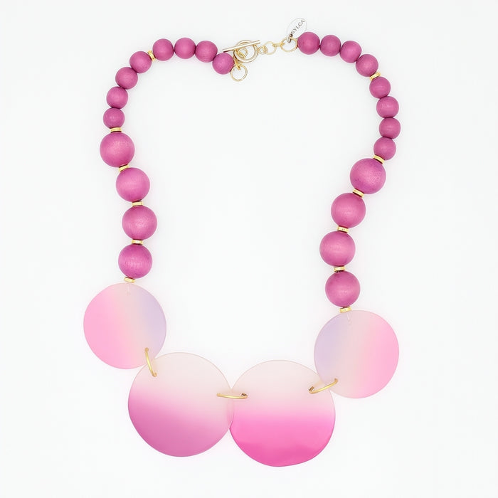 Necklace with pink and white beaded design on a white background