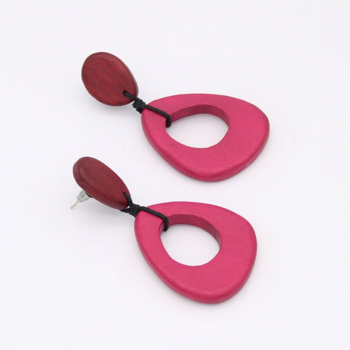 Pair of pink and red earrings on a white background