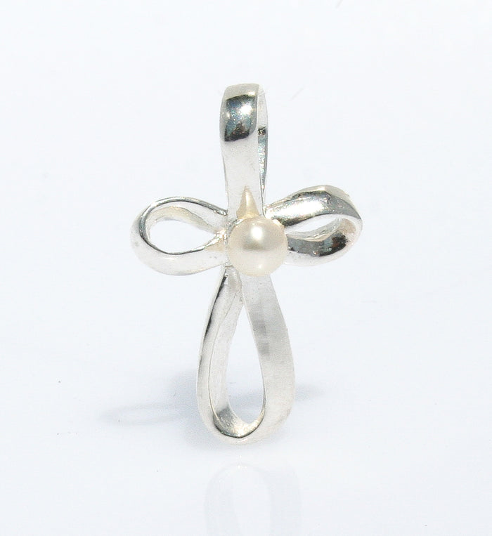 A sterling silver pendant featuring a ribbon-like cross design with a freshwater pearl at the center.
