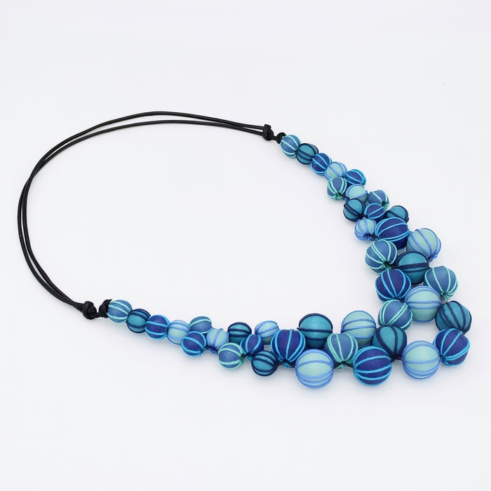 Necklace with blue beaded design on a white background