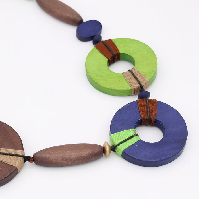 Colorful necklace with wooden beads on a white background