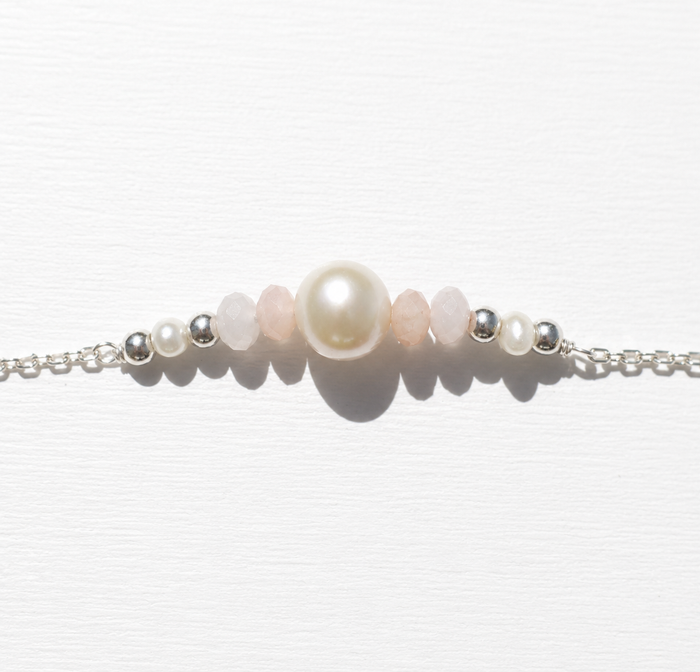 Sea Dreams Pearl Bracelet Pink Opal in 925 sterling silver with genuine freshwater pearl, soft pink opal gemstones, silver tassel details, and adjustable chain