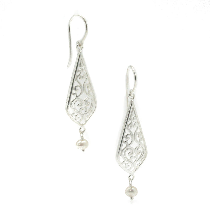 A pair of sterling silver drop earrings with intricate designs and fresh water pearl details at the bottom, hooks for attachment are visible.