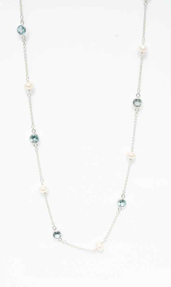 Sea Pearl Topaz Necklace in sterling silver featuring a genuine freshwater pearl and topaz gemstone.