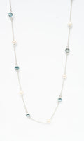 Sea Pearl Topaz Necklace in sterling silver featuring a genuine freshwater pearl and topaz gemstone.