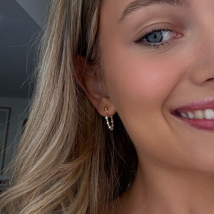 Gold loop earrings with freshwater pearls designed in Broome Western Australia