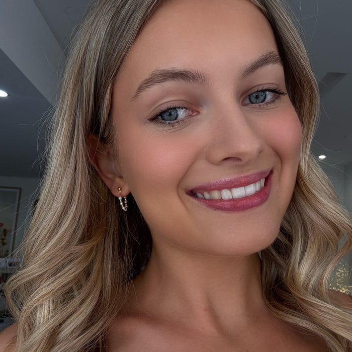 Gold loop earrings with freshwater pearls designed in Broome Western Australia