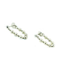 Pair of pearl loop earrings on a white background