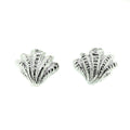 Bold sterling silver shell stud earrings with detailed textured coastal shell design inspired by European summer beach jewellery.