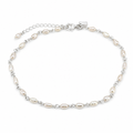 A silver chain anklet featuring irregular white freshwater pearls spaced along the chain, with a lobster clasp and extender chain