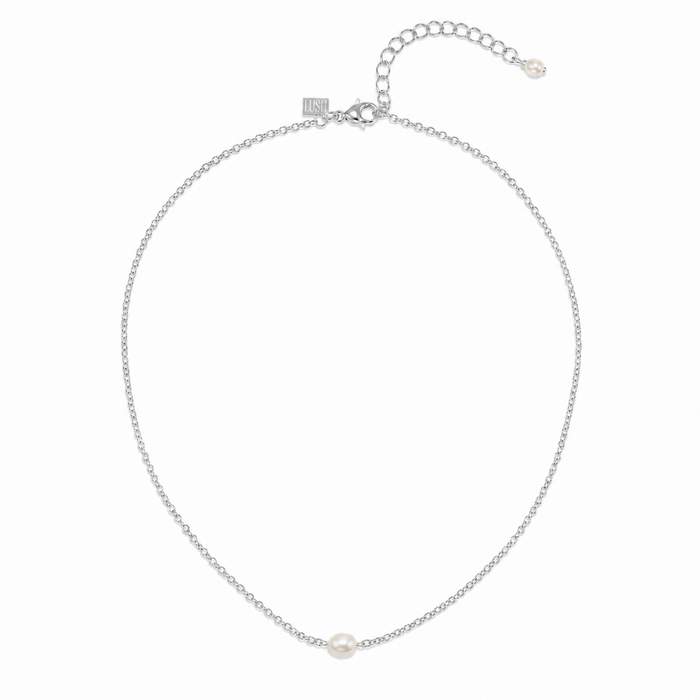 A delicate silver chain necklace featuring a single small white pearl at the center, displayed on a clean white background.