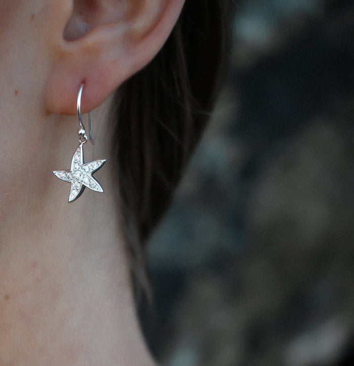 starfish hook silver earrings featuring cubic zirconia on the starfish