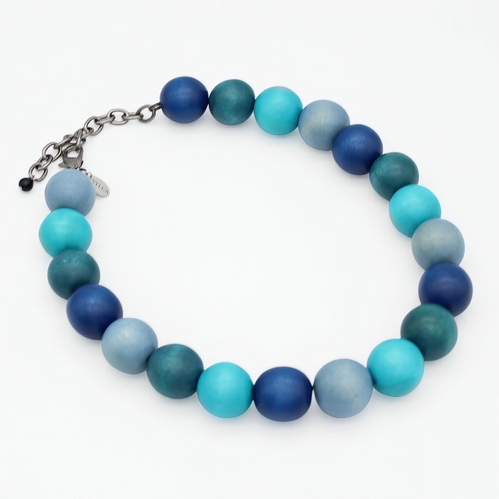 neckalce with blue and green beads on a white background