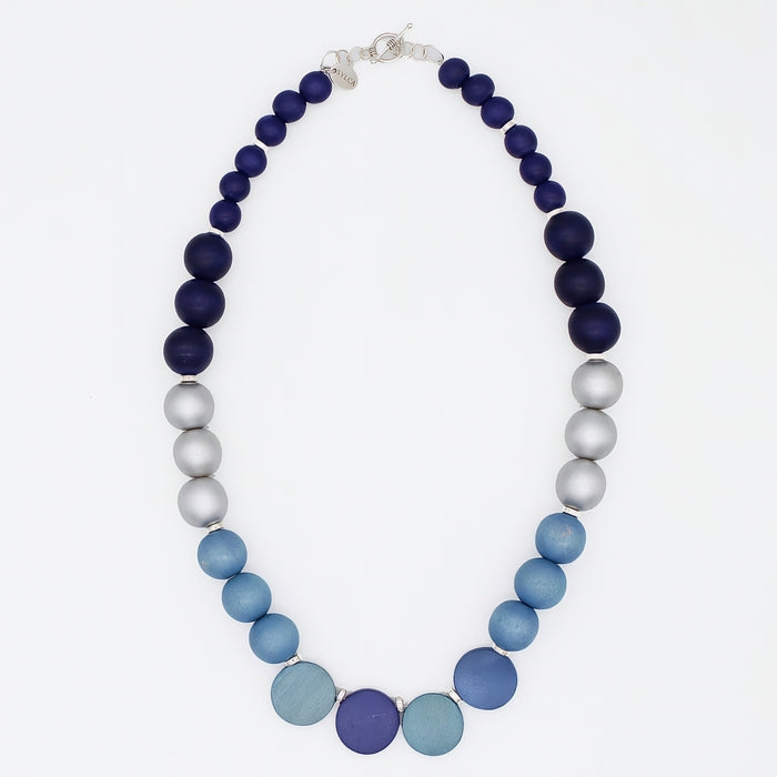 Necklace with blue and gray beads on a white background