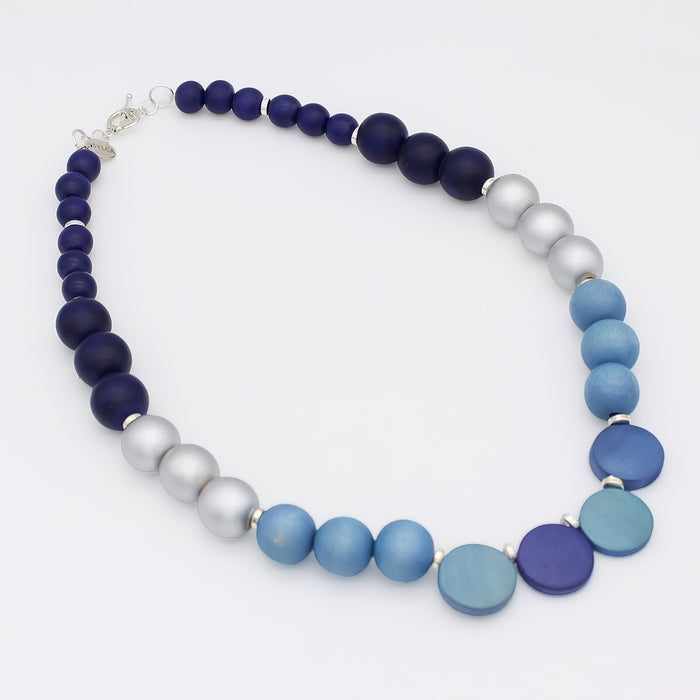 Necklace with blue and gray beads on a white background