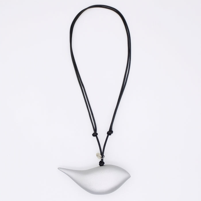 silver bird pendant on a black cord against a white background
