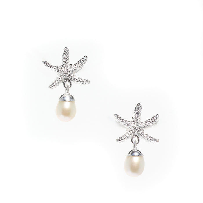 A pair of silver stud earrings featuring a starfish design with a freshwater pearl dangling below each earring.
