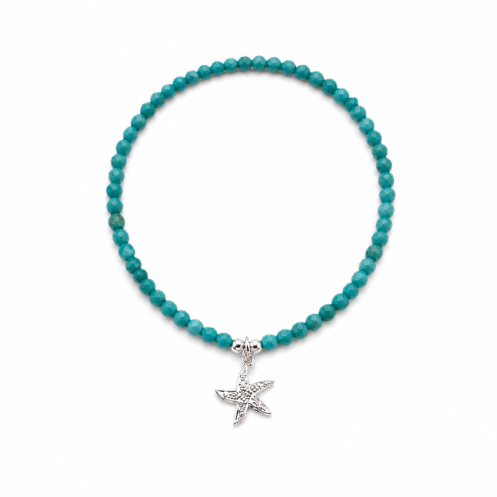 Ocean Spell Stretch Bracelet with turquoise gemstones and sterling silver starfish charm on a stretch bracelet design.