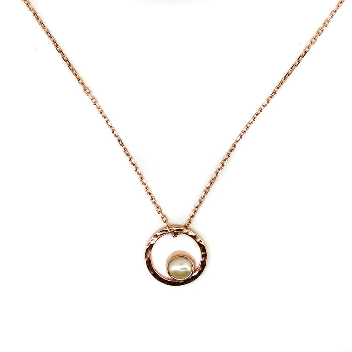 A rose gold necklace with a single pearl pendant, featuring a loop of rose gold at the top which appears to be the setting for the pearl.
