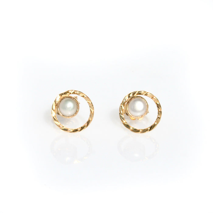 Sunset Swirls Pearl Studs Gold crafted in premium gold vermeil over sterling silver featuring genuine freshwater pearls with flowing swirl details.
