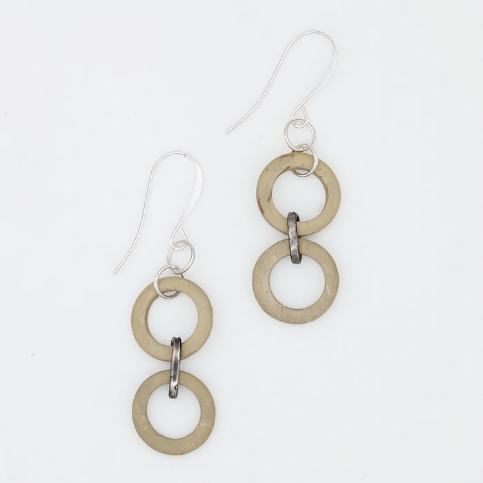 Pair of earrings with interlocking rings on a white background