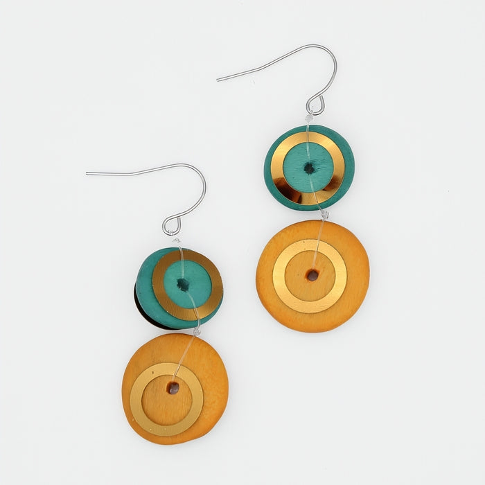 Pair of earrings with circular designs in green, gold, and orange on a white background