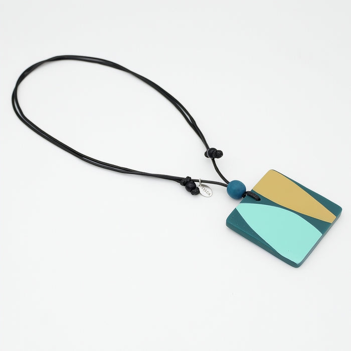 Necklace with a colorful pendant on a white background