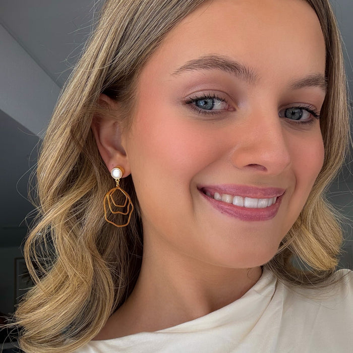 bold gold pearl studs earrings