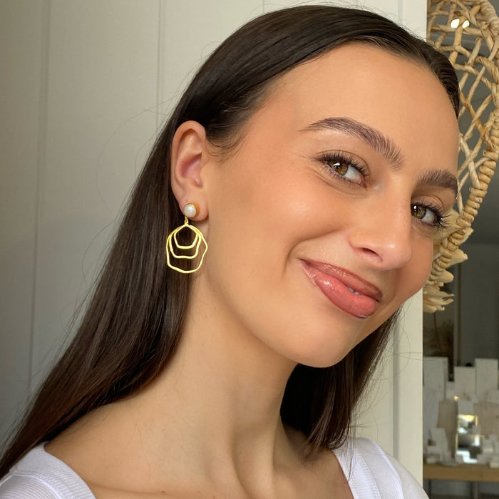 bold gold pearl studs earrings