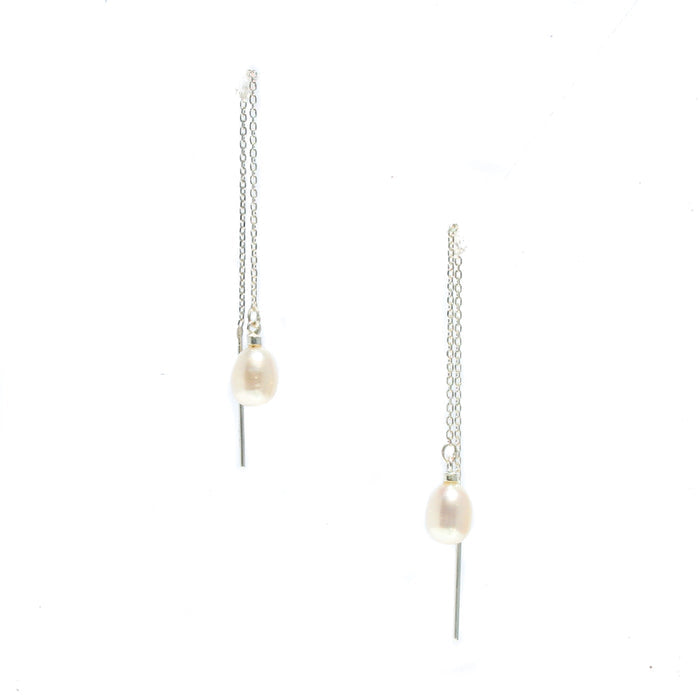 A pair of sterling silver thread earrings with white pearl accents.