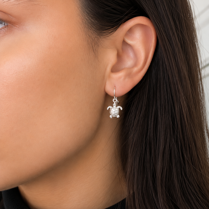 Sterling silver turtle hook earrings featuring detailed sea turtle charms, designed in Broome, Western Australia.