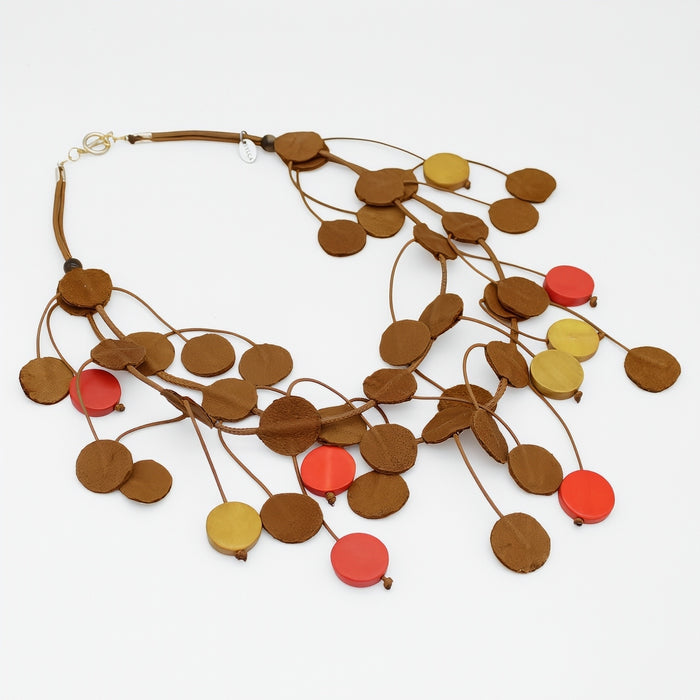Necklace with round wooden and colorful beads on a white background