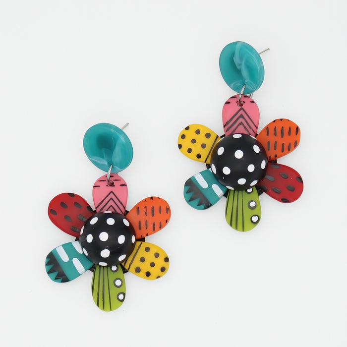 Colorful flower-shaped earrings on a white background