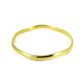 Wave Bangle Gold crafted in premium gold vermeil over sterling silver featuring an elegant polished wave-inspired coastal design.